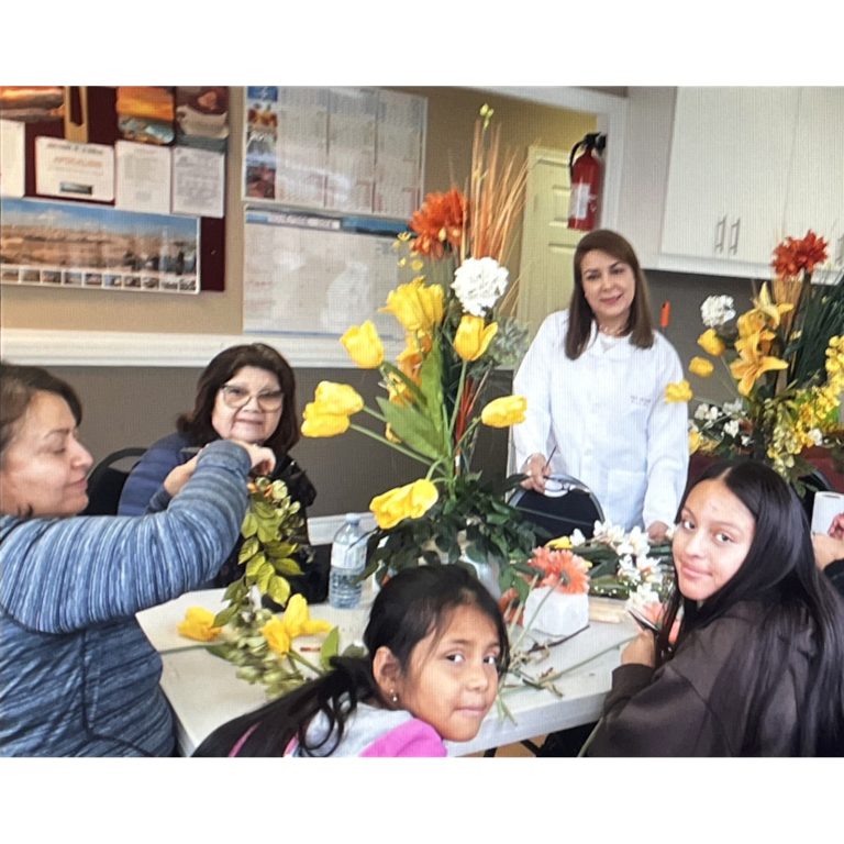 Adults and children learning together during a floral workshop