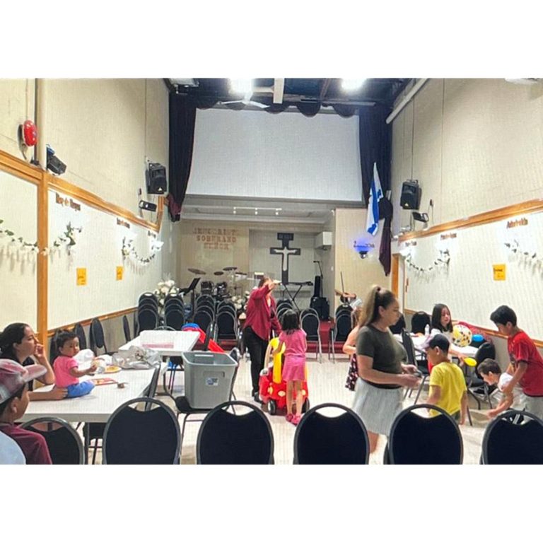 Families and children sharing an indoor community activity